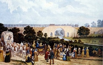 1825年のストックトン・アンド・ダーリントン鉄道の開通を描いた絵。線路ぞいに大勢の人が集まっている